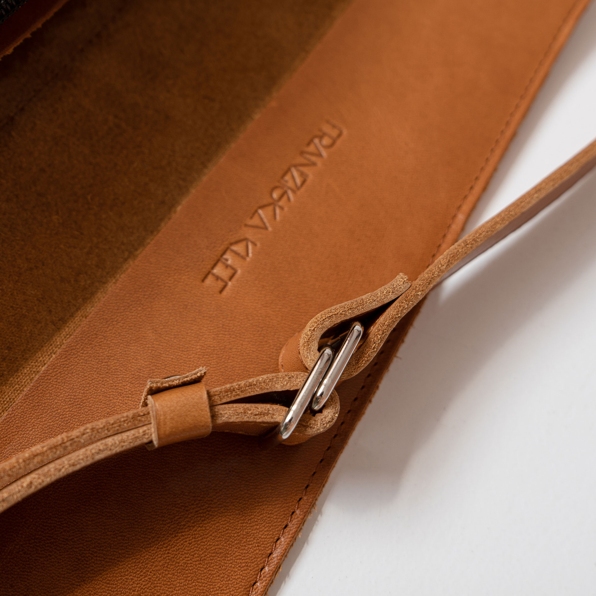 Detail Crossbody Bag TEA Large in the color cognac oiled.