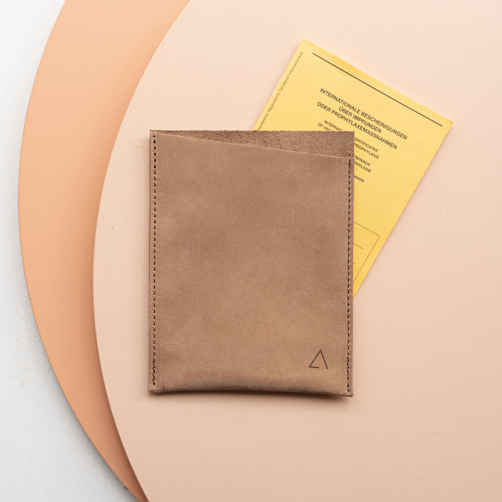 Vaccination card cover PIK made of sustainable natural leather in light brown with simple logo embossing