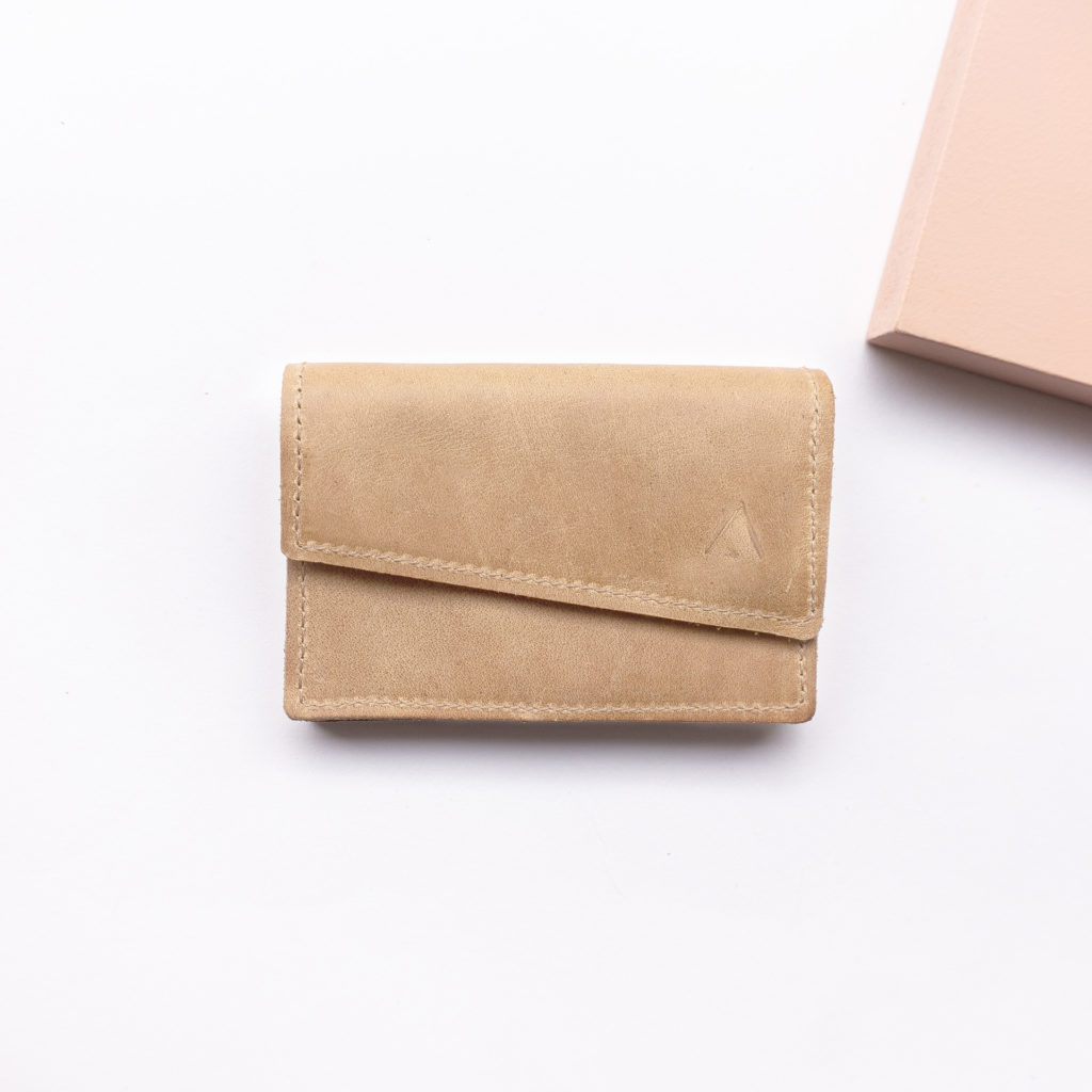 Minimalist wallet ENO natural leather in light brown from the front with logo embossing