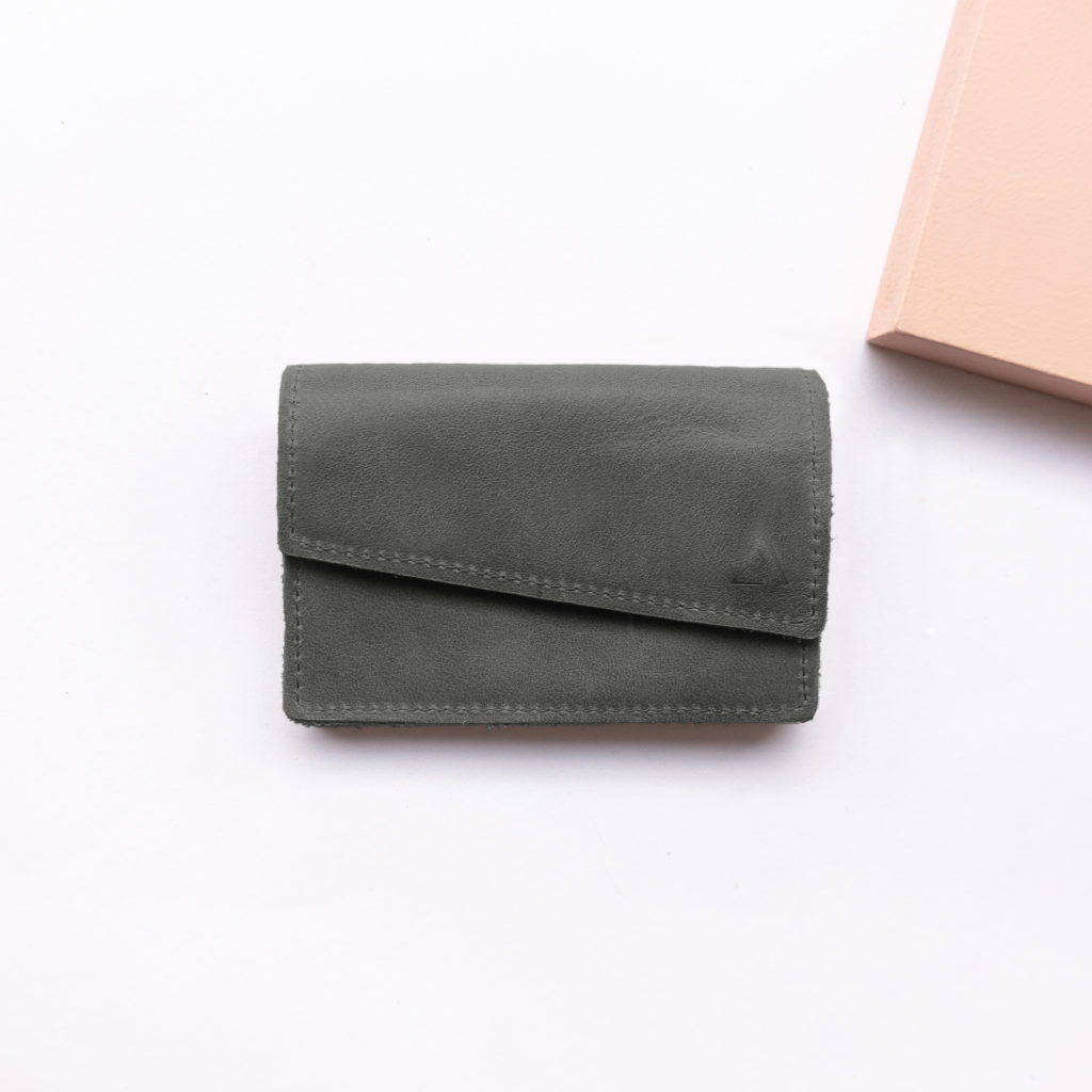 Minimalist wallet ENO natural leather in stone gray from the front with logo embossing