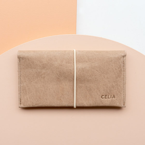 Wallet OLI XLARGE made of sustainable natural leather in light brown with cream-colored closure band and individual embossing "Celia".
