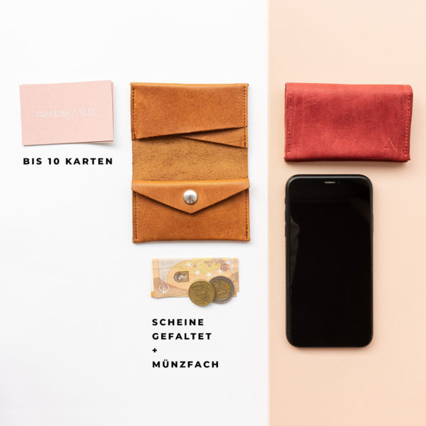 Wallet OLI MIDI in cognac oiled and red with space for up to 10 cards, folded banknotes and coins in size comparison with cell phone