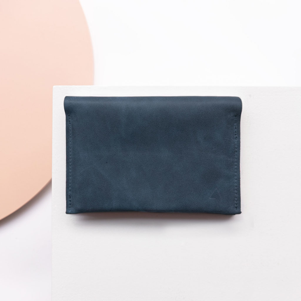 Wallet OLI LARGE made of sustainable natural leather in dark blue from the front with logo embossing