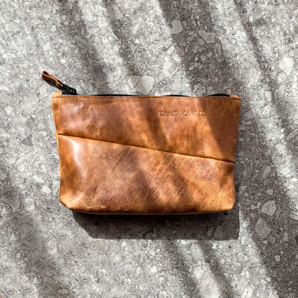 Cosmetic bag Pouch FRA made of sustainable natural leather in cognac oiled with logo embossing from the front