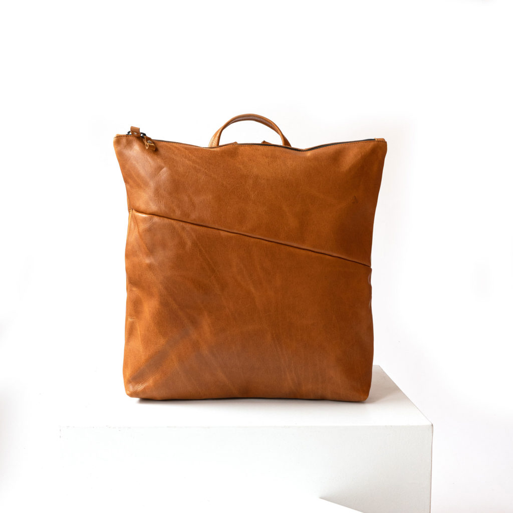 Front of the wrap backpack LIN made of sustainable natural leather oiled in cognac