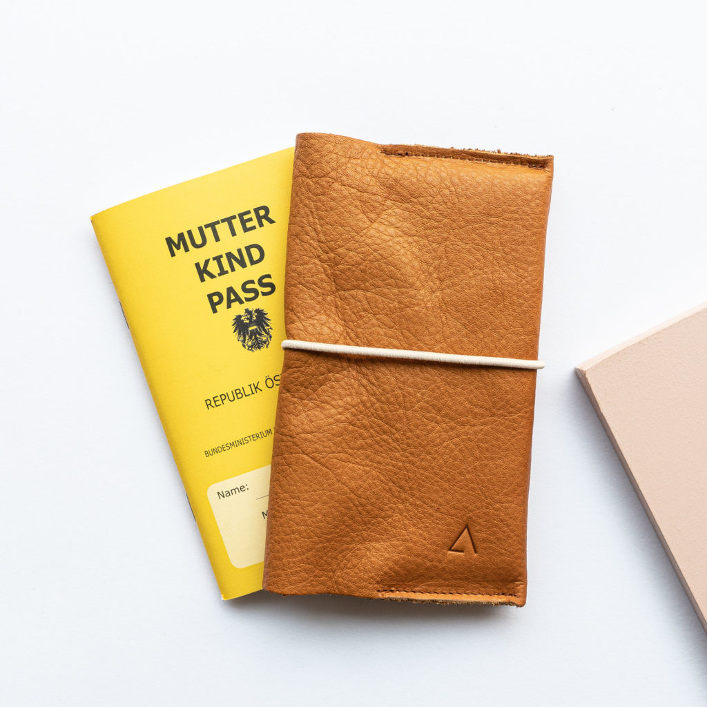 Mother and child passport cover EVE Austria natural leather in cognac with subtle logo embossing and cream-colored closure band
