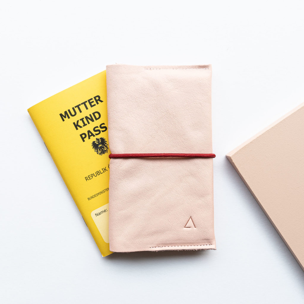 Mother and child passport cover EVE Austria natural leather in pink with discreet logo embossing and red closure band
