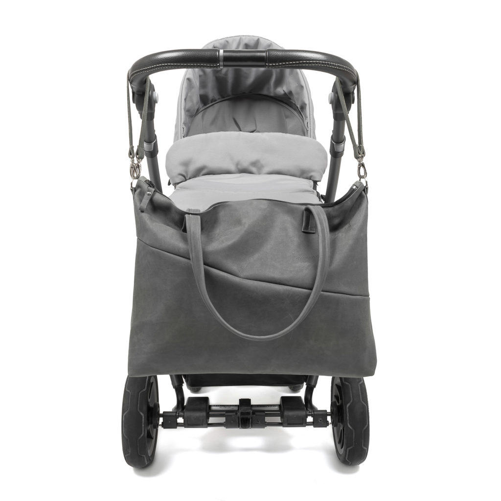 Diaper bag ELA natural leather in stone gray with suspension attached to stroller